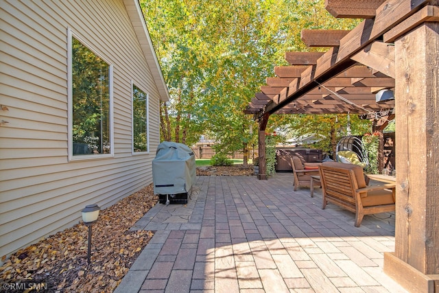 view of patio / terrace with a grill and a pergola