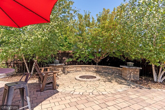 view of patio / terrace featuring a fire pit