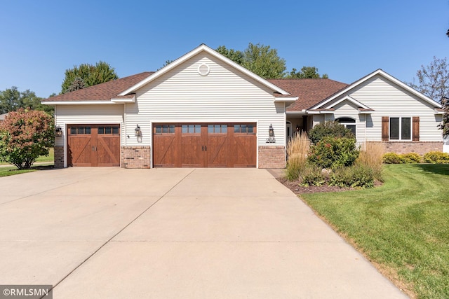 view of front of house with a front lawn and a garage