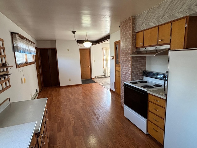 kitchen with pendant lighting, white appliances, and dark wood-type flooring