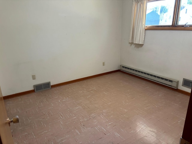 empty room with a baseboard heating unit