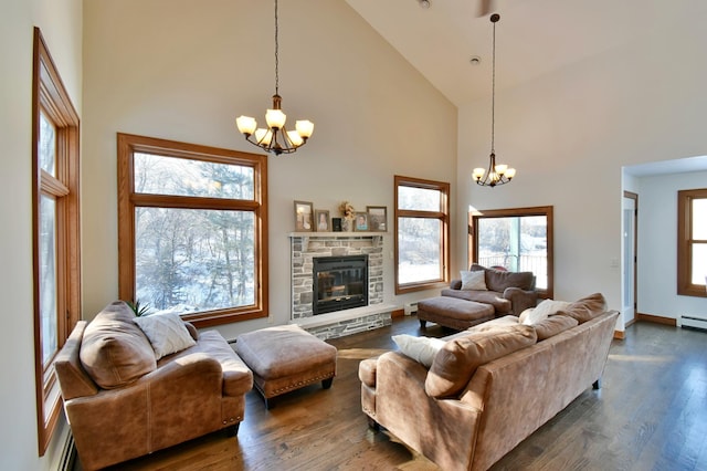 living room with high vaulted ceiling and an inviting chandelier