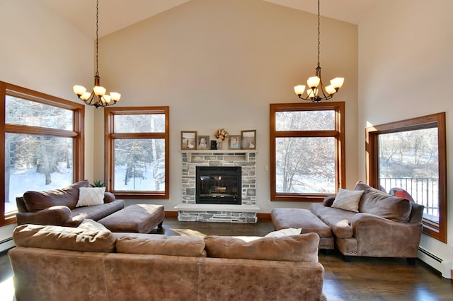 living room featuring high vaulted ceiling, an inviting chandelier, and a fireplace