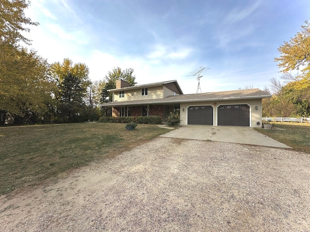 view of front facade featuring a front yard and a garage