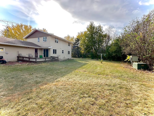 view of yard featuring a wooden deck