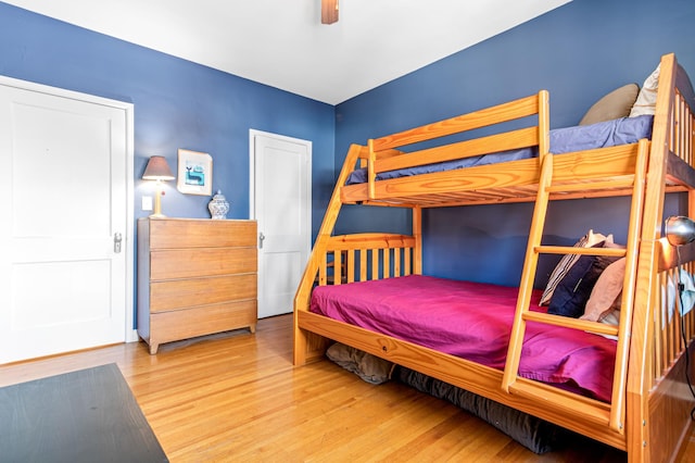 bedroom with hardwood / wood-style flooring and ceiling fan