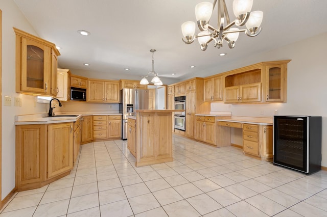 kitchen with beverage cooler, stainless steel appliances, sink, pendant lighting, and a center island