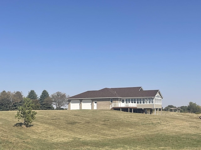 back of property featuring a yard