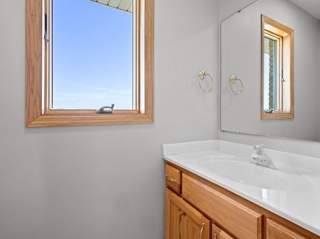 bathroom with vanity and plenty of natural light