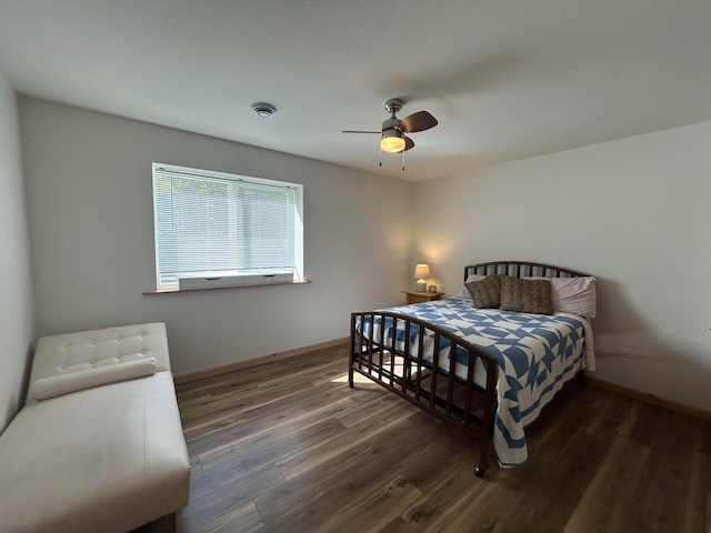 bedroom featuring ceiling fan and dark hardwood / wood-style flooring