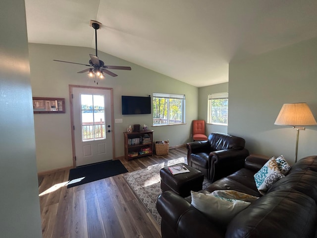 living room with vaulted ceiling, dark hardwood / wood-style flooring, and ceiling fan