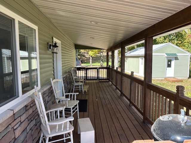 deck featuring a shed