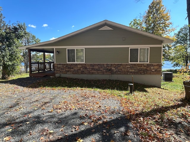 view of side of home featuring central AC