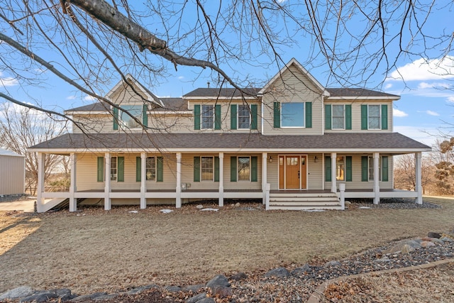 country-style home featuring a porch