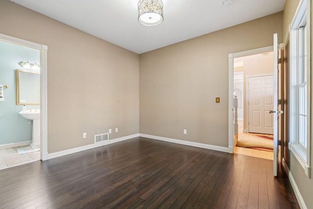 empty room featuring dark hardwood / wood-style floors