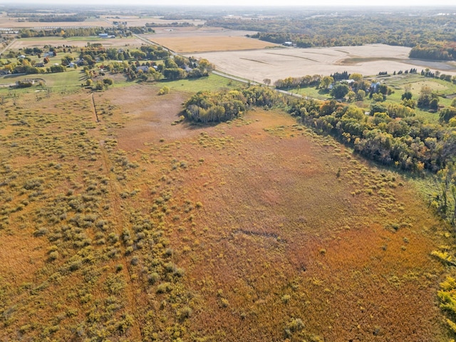 birds eye view of property with a rural view