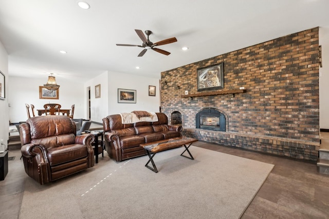 living room with ceiling fan and a brick fireplace