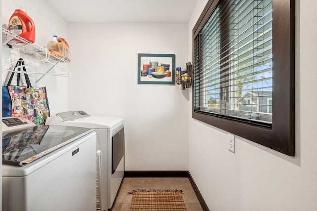 clothes washing area featuring washer and clothes dryer