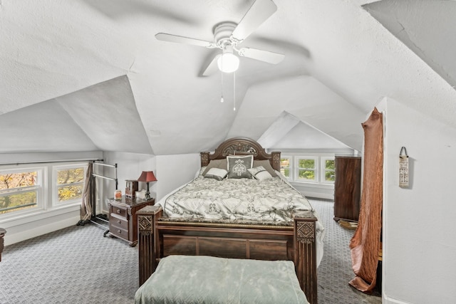 carpeted bedroom featuring a textured ceiling, ceiling fan, and lofted ceiling