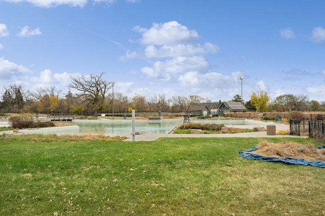 exterior space featuring a water view and a lawn