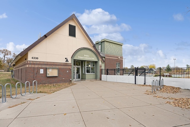 view of front of home with fence