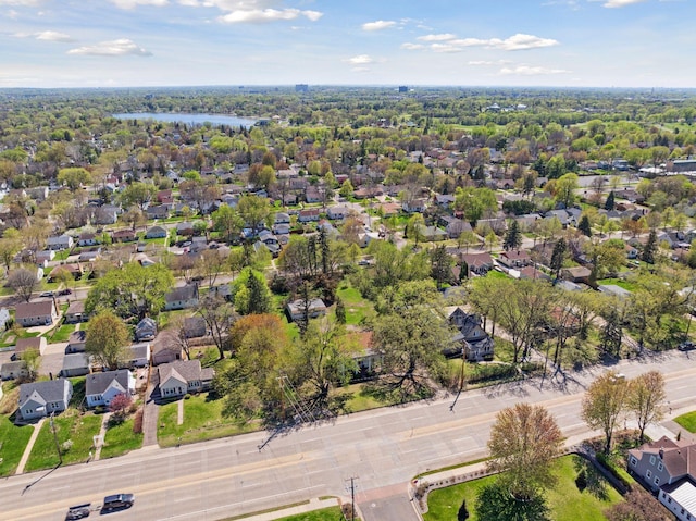 aerial view of residential area featuring a large body of water