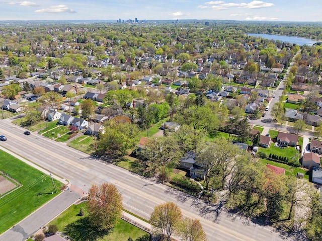 aerial perspective of suburban area with a nearby body of water
