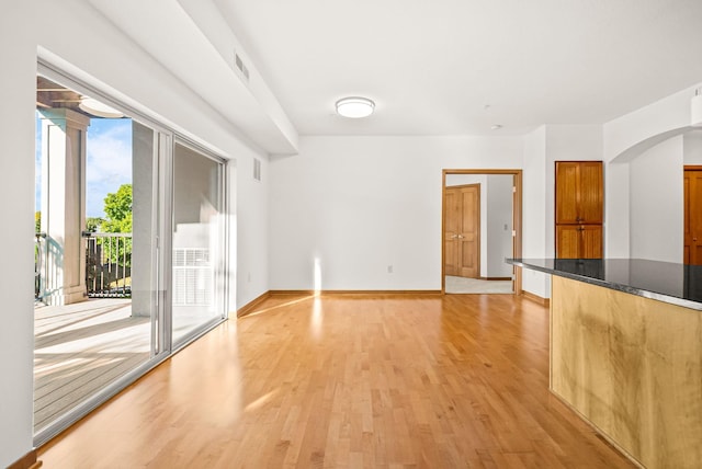 unfurnished living room featuring light hardwood / wood-style flooring