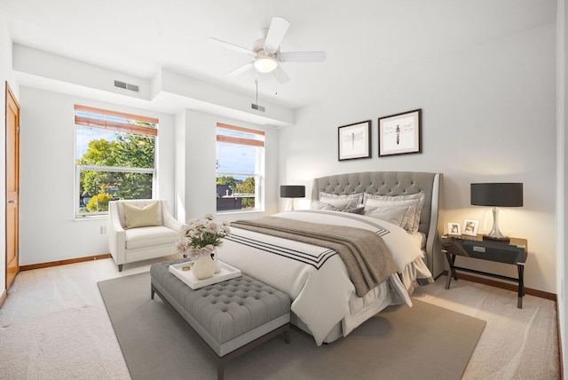 bedroom with light carpet and ceiling fan