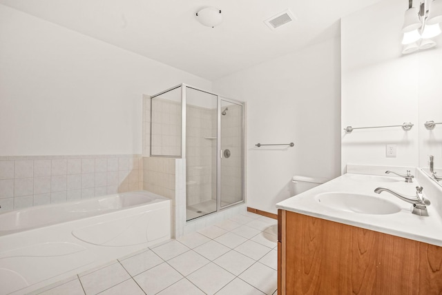 full bathroom with vanity, toilet, tile patterned floors, and independent shower and bath