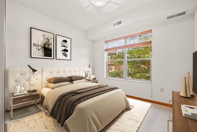 bedroom with light carpet