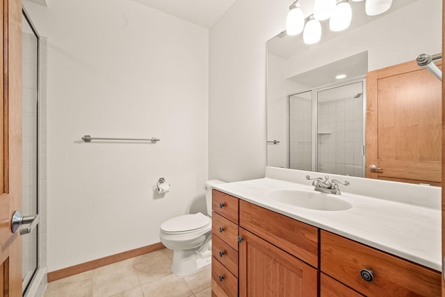 bathroom featuring vanity, toilet, tile patterned floors, and walk in shower