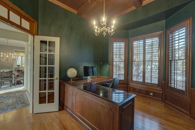 office area with beam ceiling, light hardwood / wood-style flooring, an inviting chandelier, and crown molding