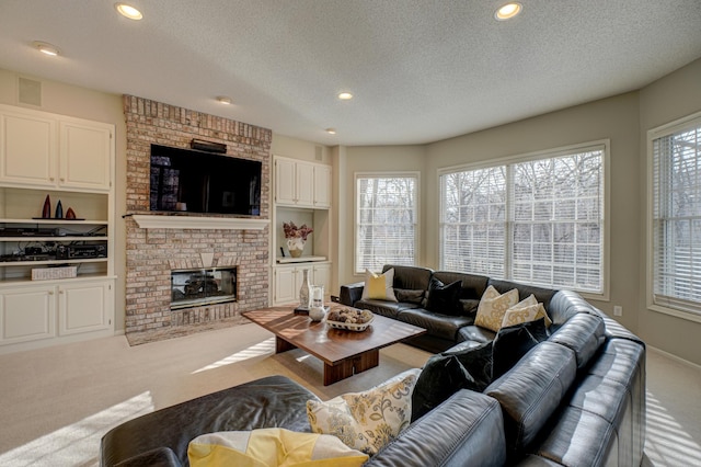 living room with a fireplace, a textured ceiling, and carpet floors