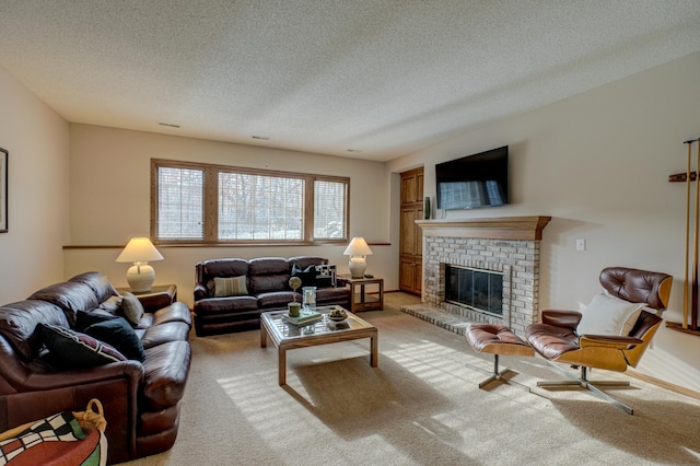 carpeted living room with a brick fireplace and a textured ceiling