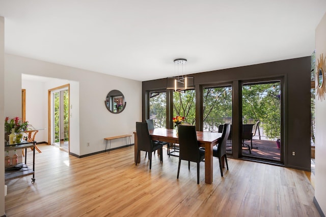 dining area featuring light wood-type flooring