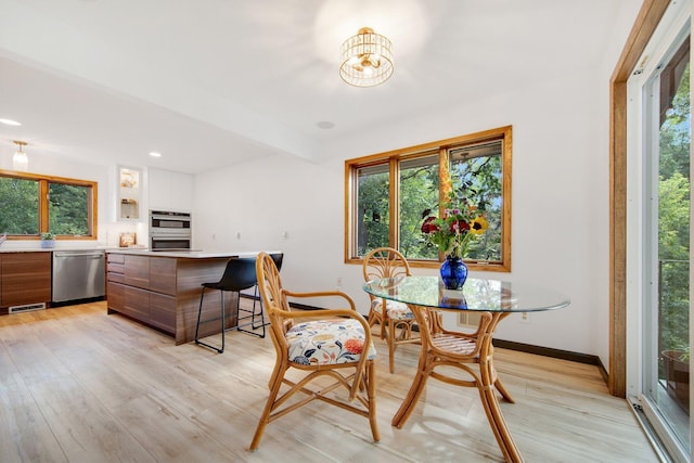 dining room with light wood-type flooring