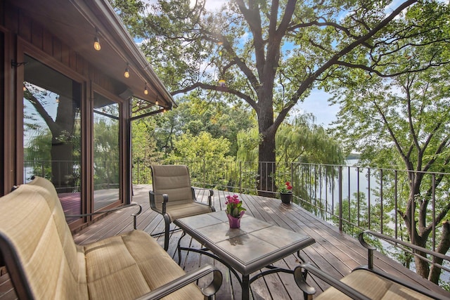 wooden deck with a sunroom