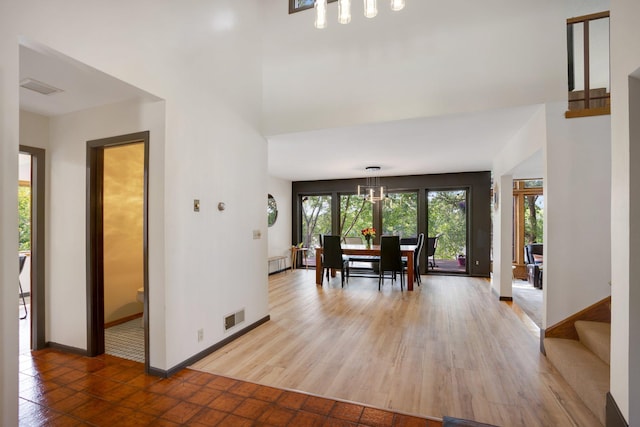 dining space with wood-type flooring