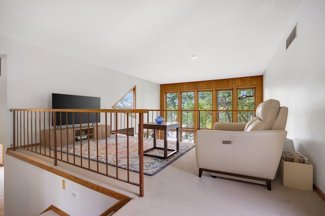 living room featuring light carpet