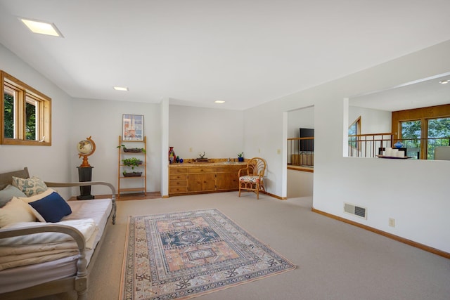 living room with plenty of natural light and carpet flooring