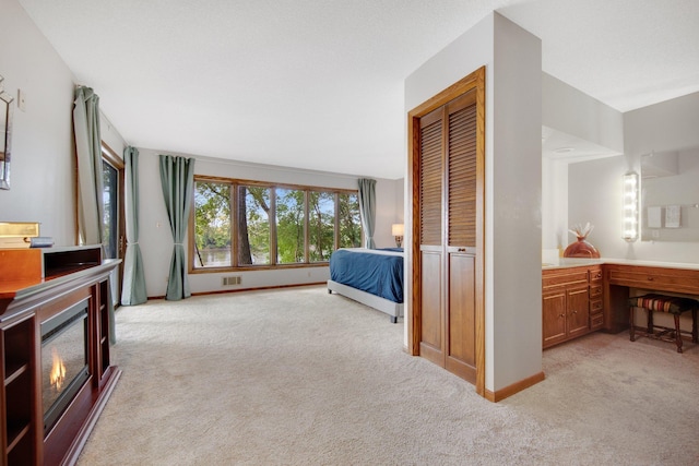 carpeted bedroom featuring a closet