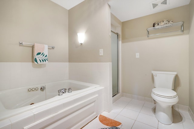 bathroom featuring separate shower and tub, toilet, and tile patterned floors