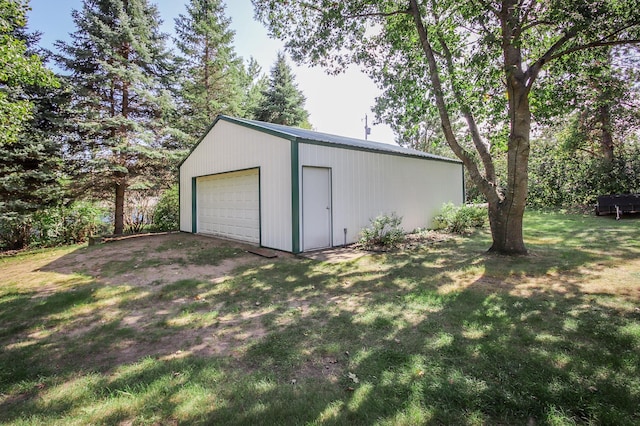 garage with a lawn