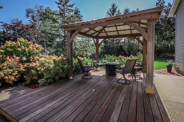 wooden terrace featuring a gazebo