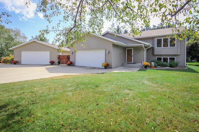 split level home with a garage and a front yard