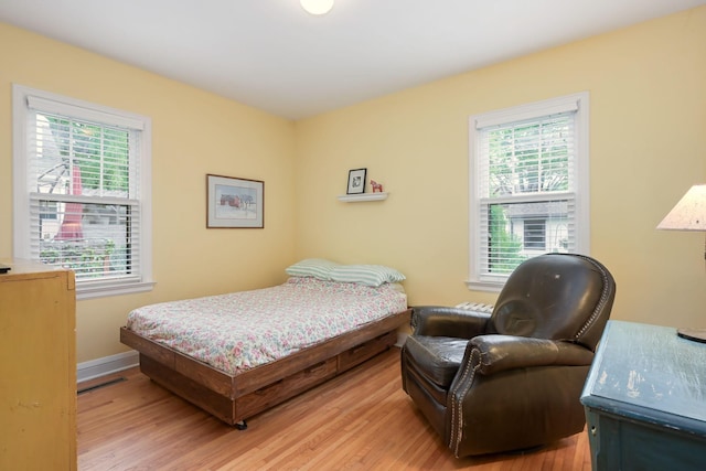5025 16th Ave S, Minneapolis, MN 55417 - bedroom with multiple windows and light wood-style flooring