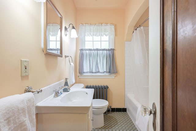 5025 16th Ave S, Minneapolis, MN 55417 - full bath with toilet, tile patterned floors, vanity, radiator heating unit, and baseboards