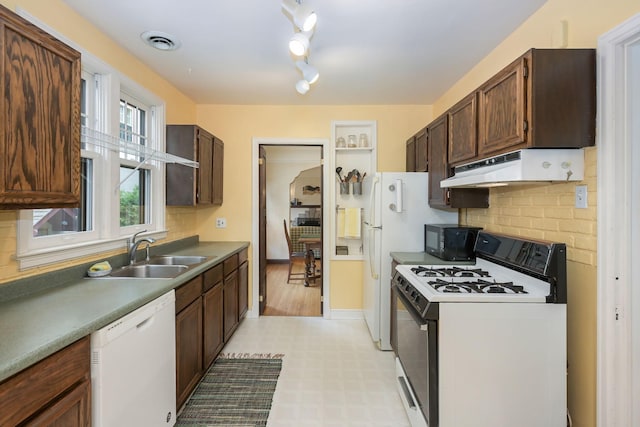 5025 16th Ave S, Minneapolis, MN 55417 - kitchen featuring white appliances, under cabinet range hood, a sink, decorative backsplash, and light floors