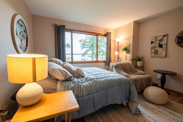 bedroom with hardwood / wood-style floors